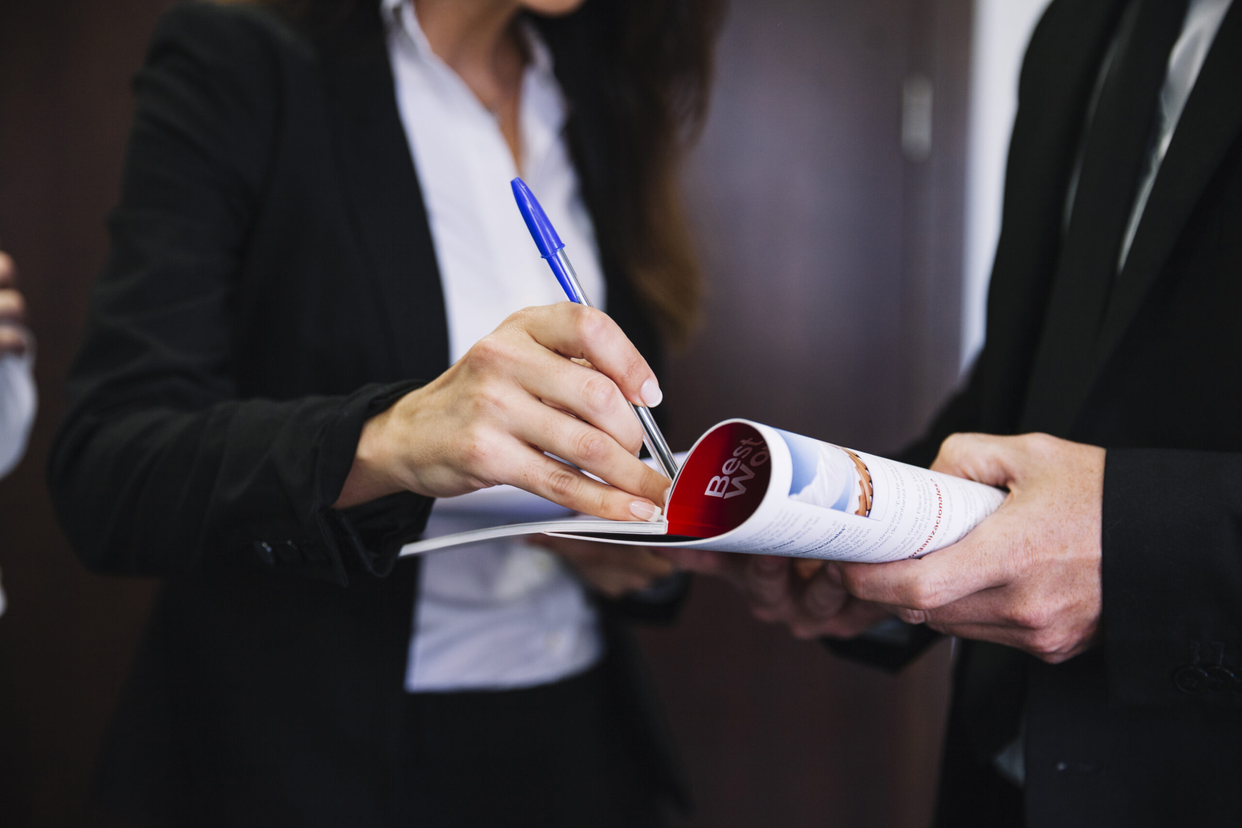 corporate-business-people-holding-brochure