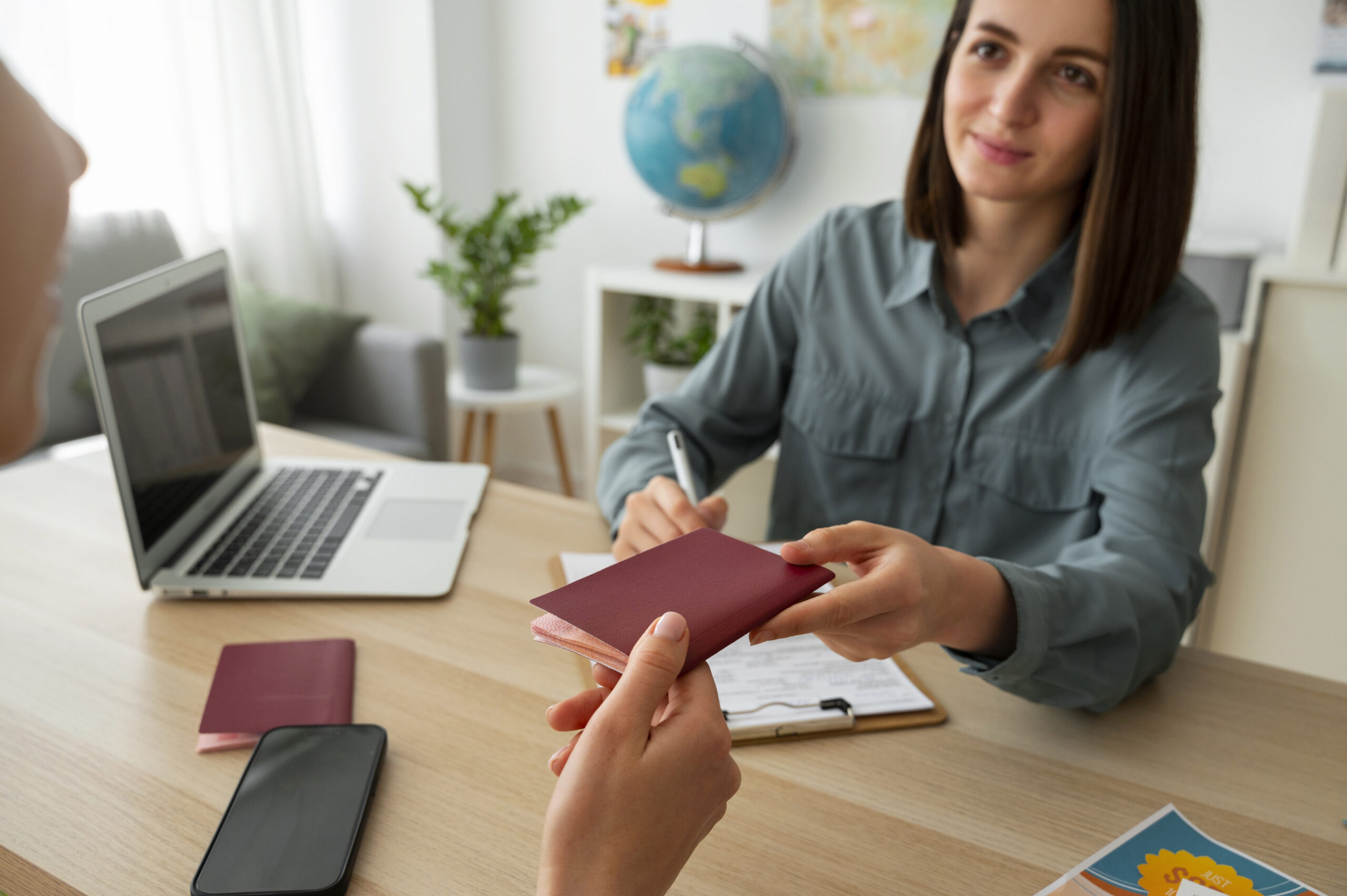 high-angle-woman-working-as-travel-agent