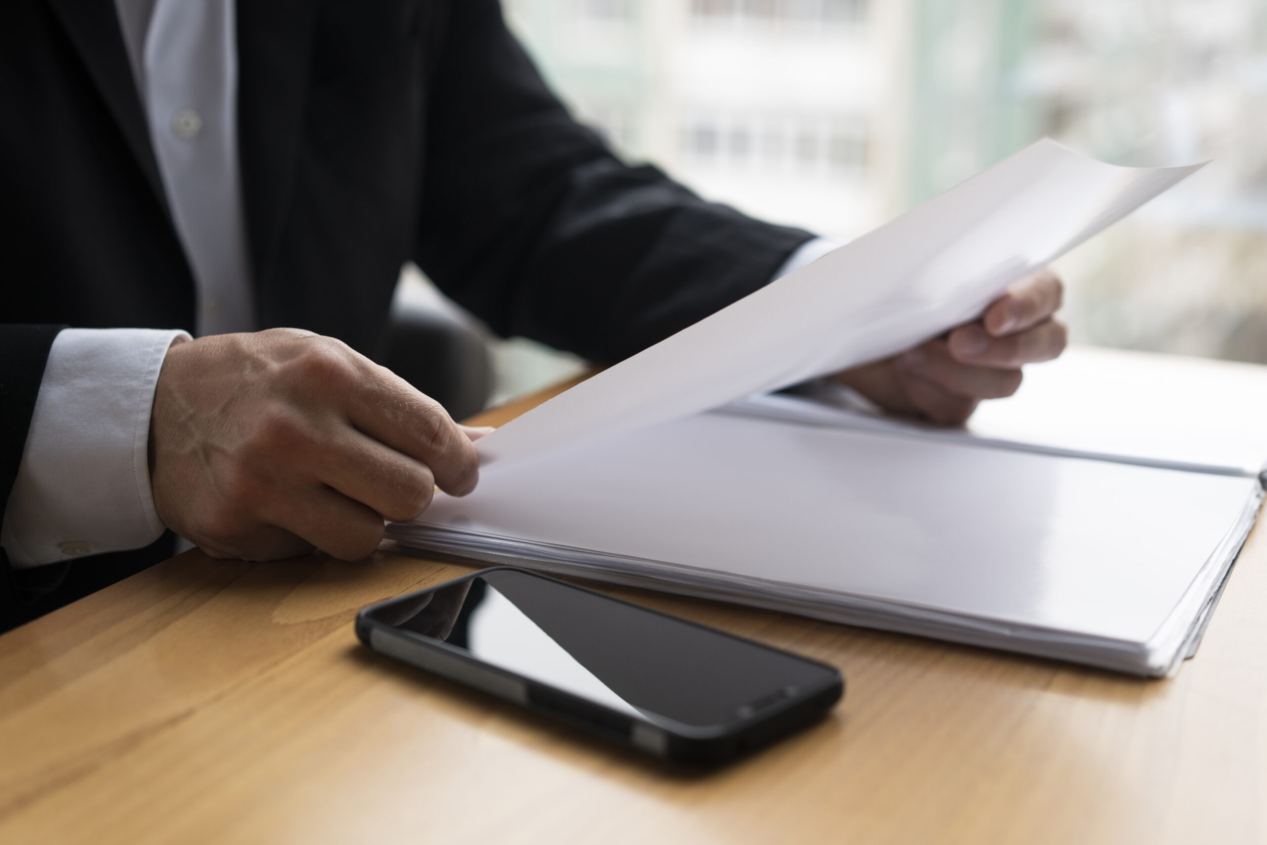 business-man-holding-glossy-paper