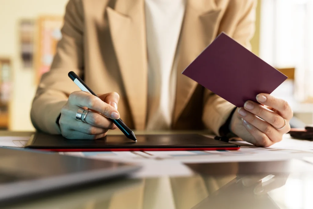 Person reviewing passport and signing documents for certificate attestation kochi